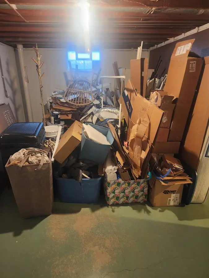 Roll-off dumpster container at job site for 2 Yard Dumpster Rental in Marlin